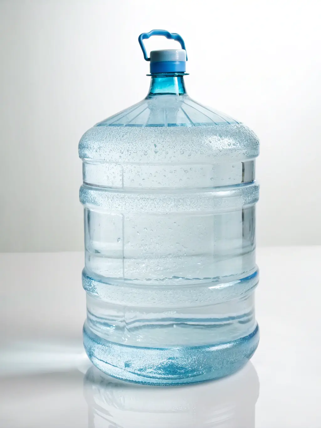 A clear, refreshing bottle of LEO PRIME TABLE WATER (500ml) with condensation, placed on a clean, white surface, highlighting its purity and appeal.